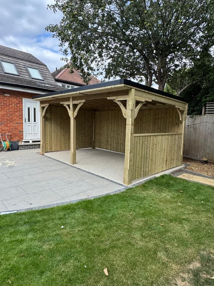 The Islington gazebo beside a lawn, with half-height timber cladding on one side