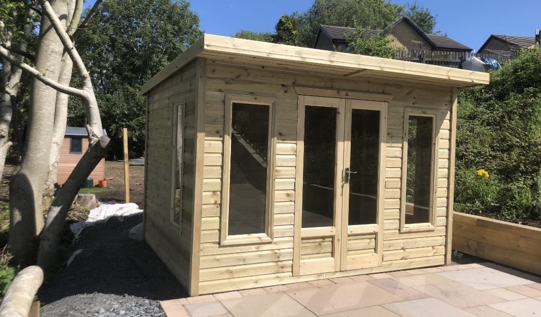 A timber garden room with double doors and side windows in Ulnes Walton, Leyland