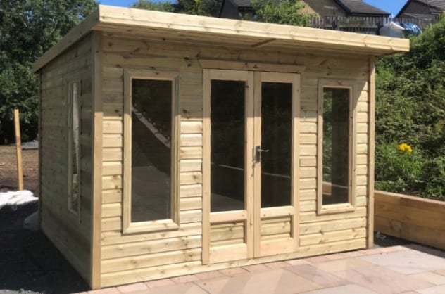 Front view of the timber garden room with glazed double doors
